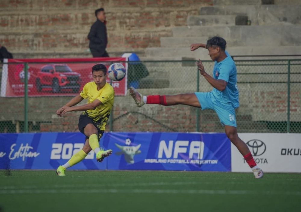 Players of CDFA (yellow) and PDFA (blue) vie for the ball during the football Match No 16 of the ongoing 25th Dr T Ao Trophy at Renpo Lu Sports Complex, Ungma, Mokokchung on October 17.